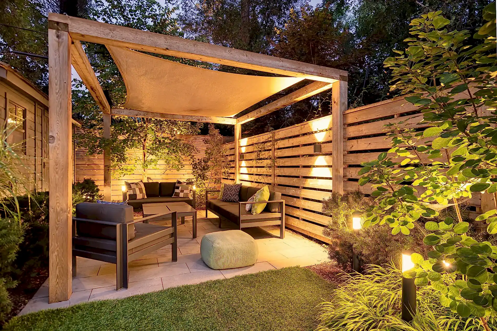 Modern backyard patio with cabana shade cover and outdoor seating