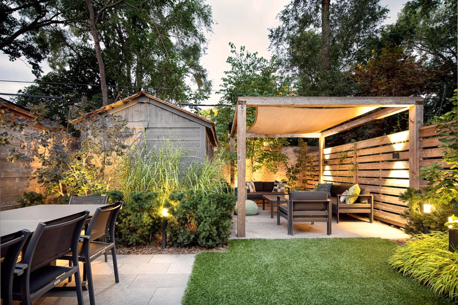 Modern backyard patio with outdoor dining area and couch seating