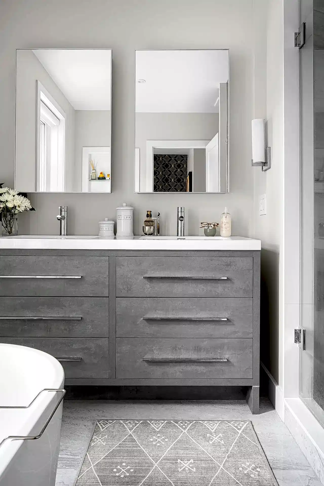 Bright white and gray modern contemporary primary bedroom and en suite bathroom
