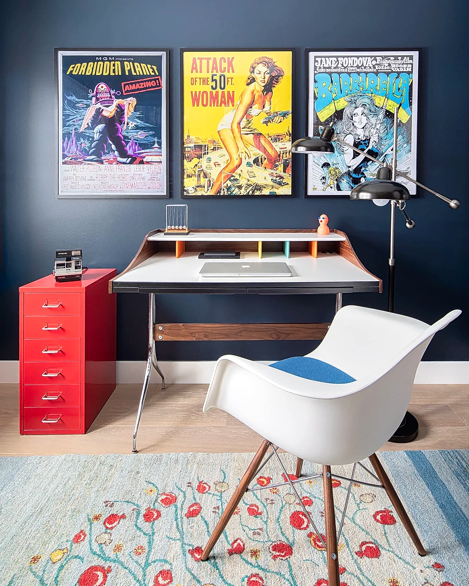 Cozy mid-century modern home office with wood bookcase and yellow velvet reading chair