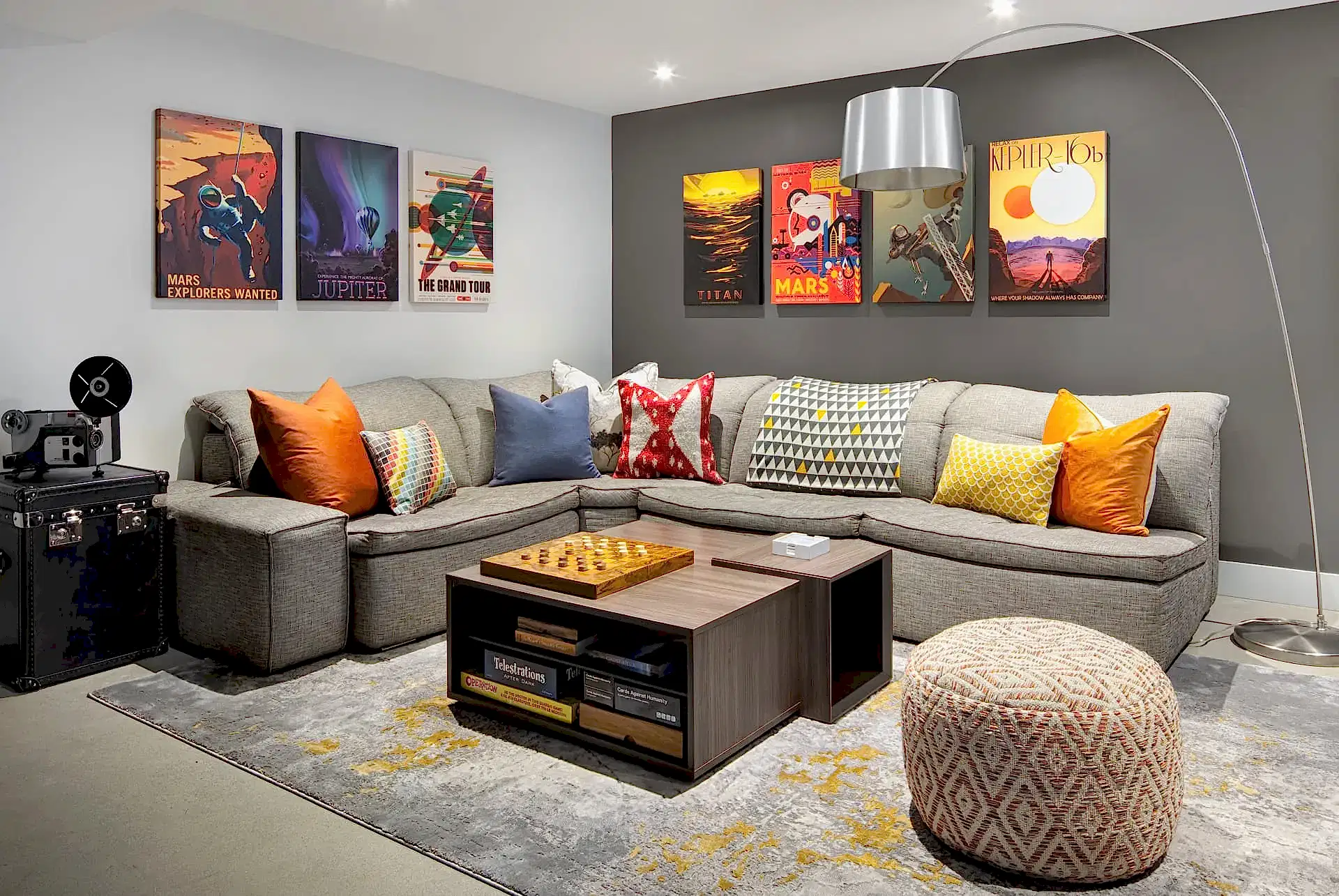 Cozy retro modern home theater room with beige couch and poster wall