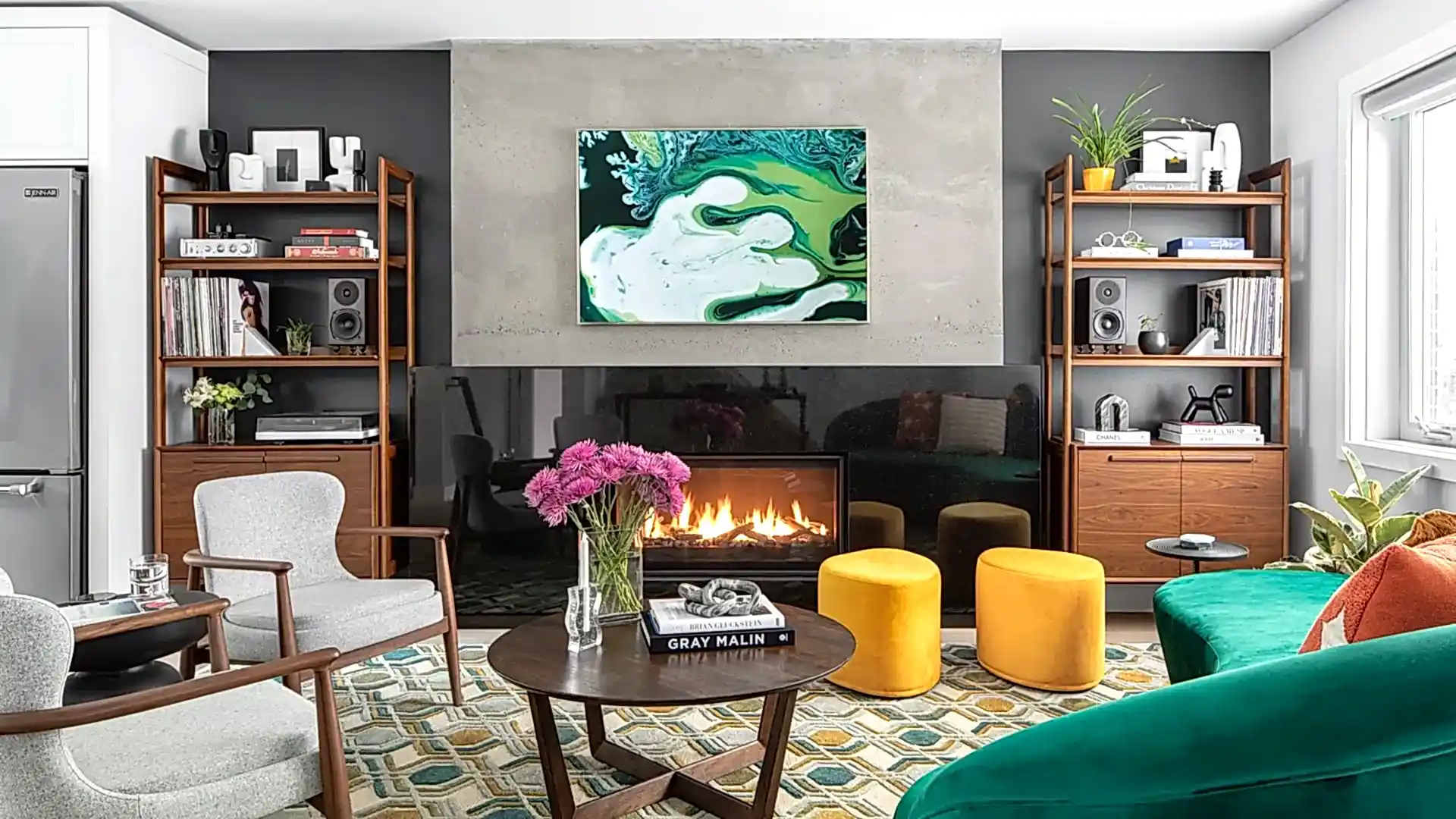 Colour mid-century modern living room with wood shelves and green couch at Valleyview Project