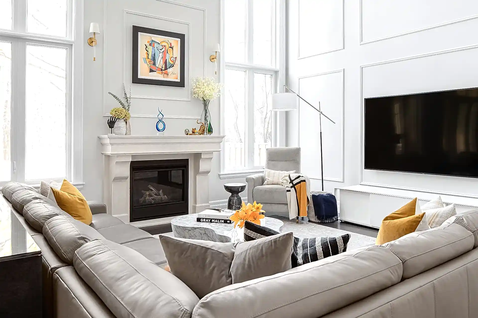 Bright modern transitional living room with leather sectional